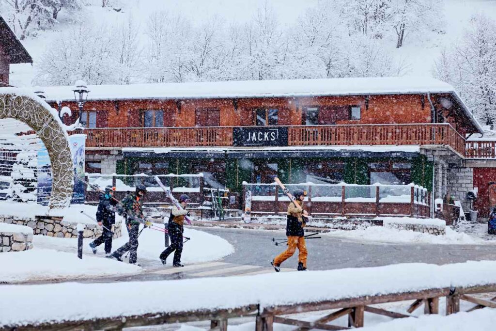 Skiers outside Hotel Grangettes in Méribel, the only true ski in ski out hotel in the Chaudanne area with direct access to main lifts.